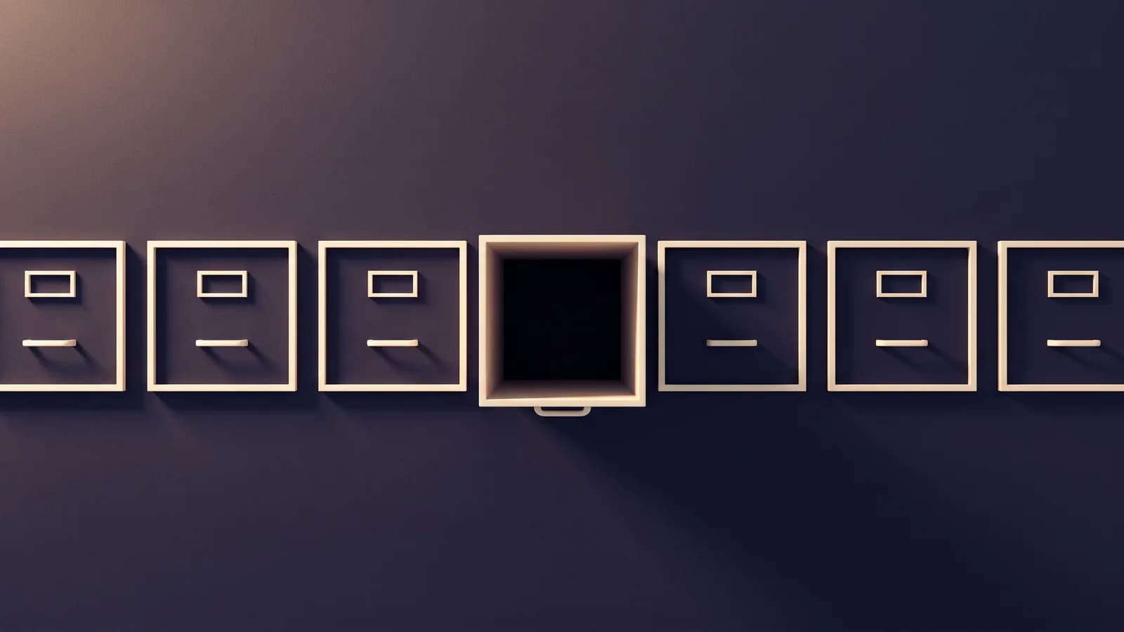 A row of empty dark drawers, one of them pulled open and holding nothing